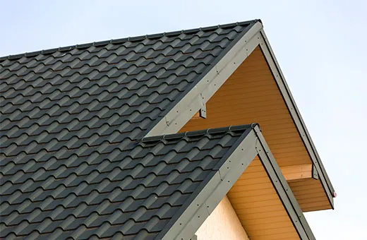 Close up of modern house top with shingled roof