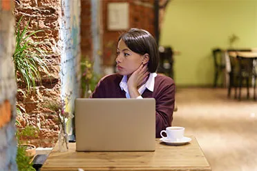 Woman working at a café table