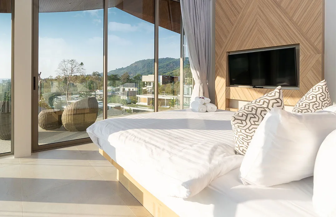 Bedroom interior with a pool view